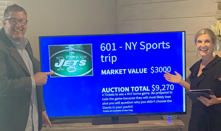 Live streaming fundraising totals during a virtual event with an online auction.