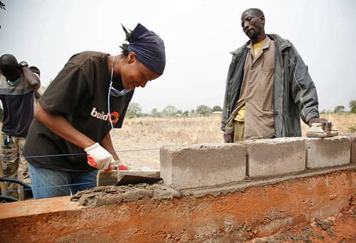 Buildon Woman lays bricks