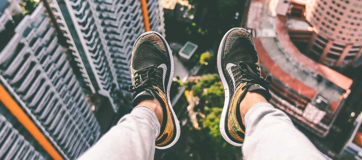 nike shoes dangling off building