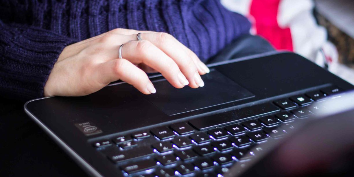 woman typing on laptop