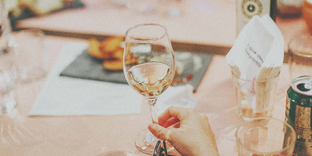 Glass of white wine on a banquet table