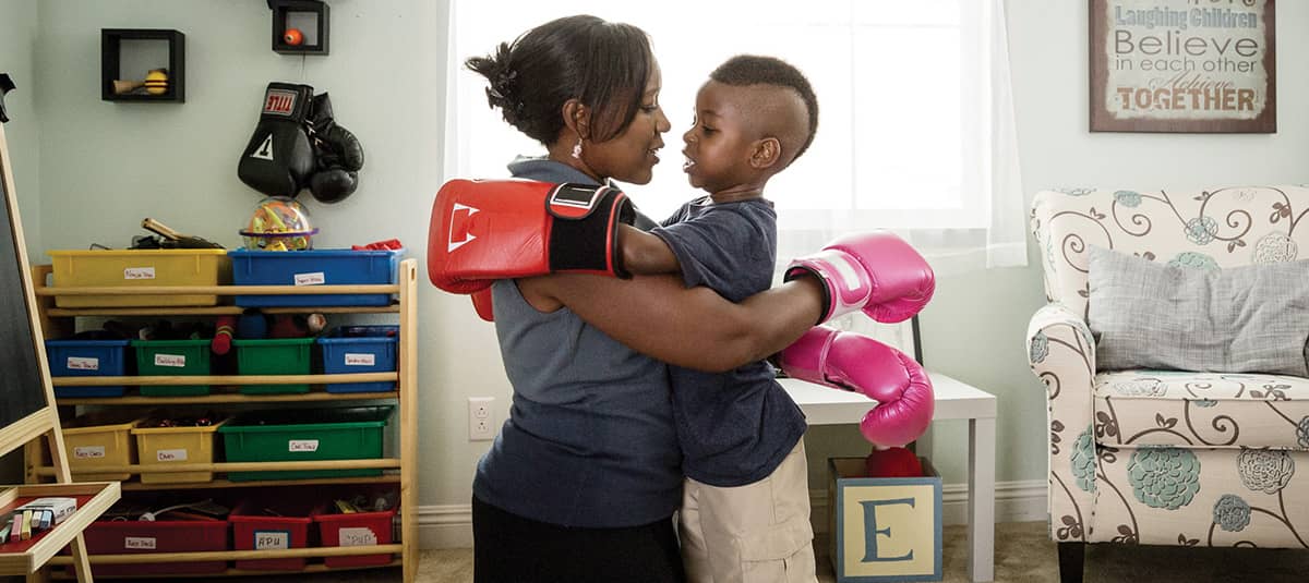 mom and son with boxing gloves on