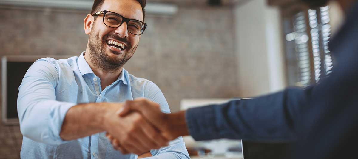 two men shaking hands