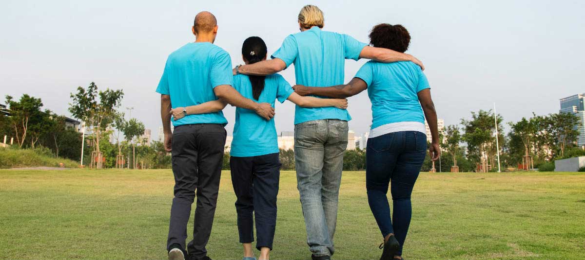 blue shirt volunteers walking together
