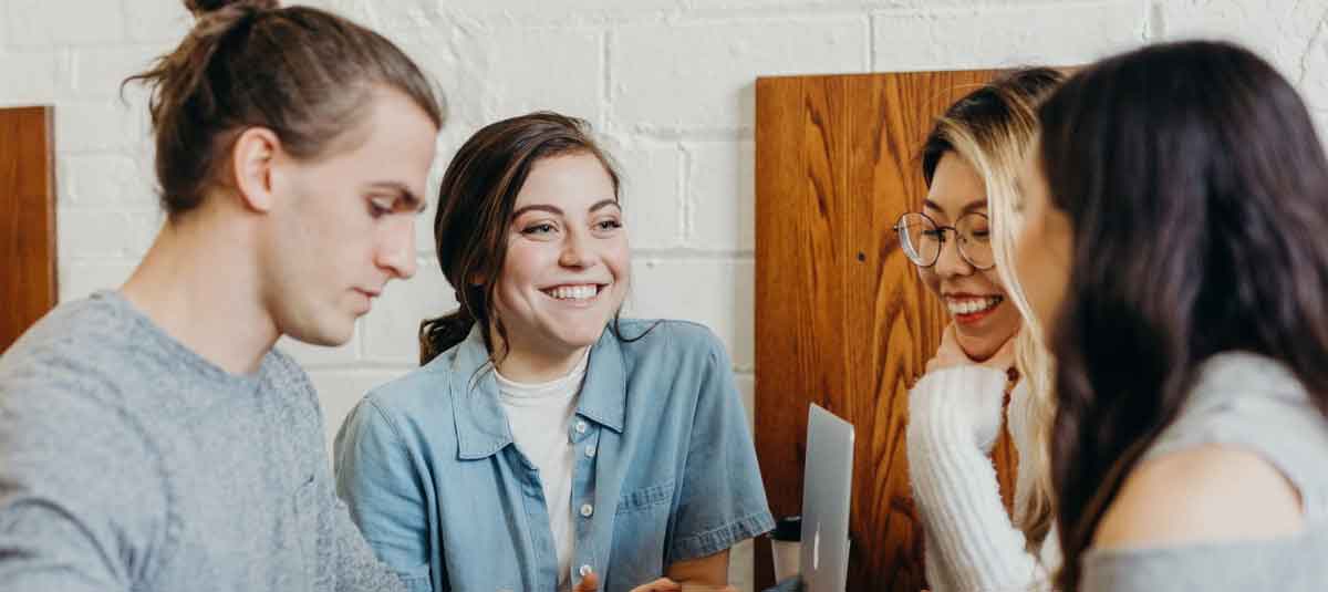 four people talking