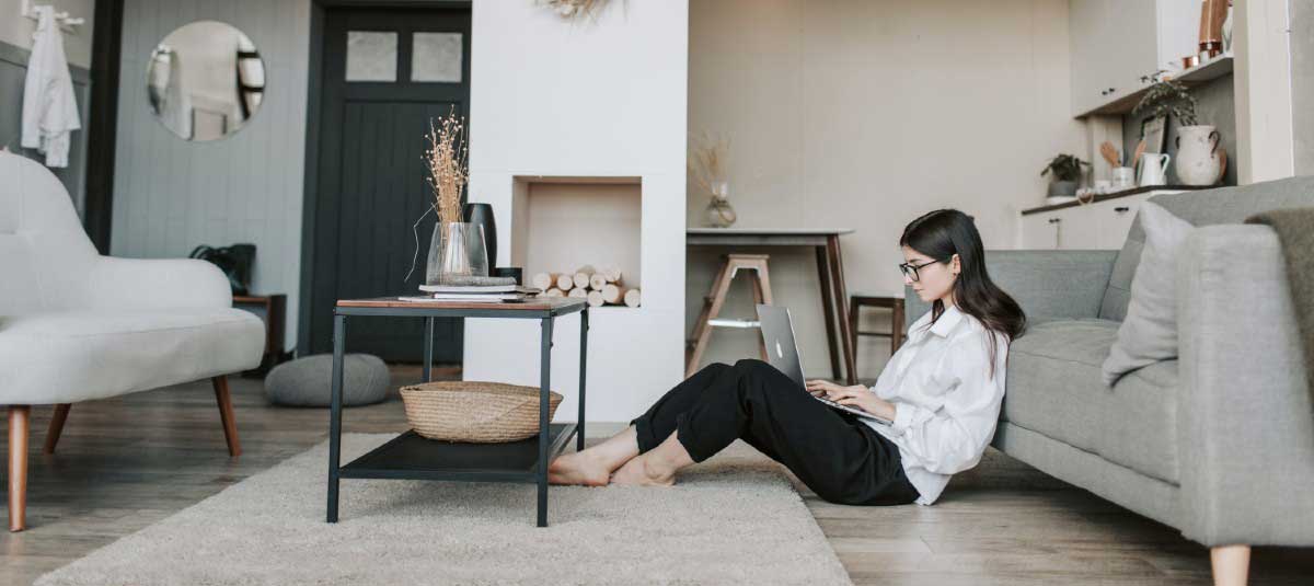 woman typing on the floor