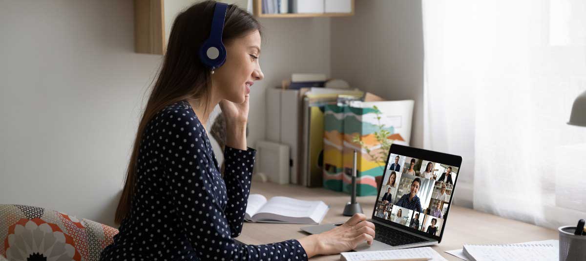 woman with headphones on virtual event