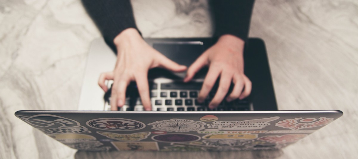 Person Creating Strategy on Laptop