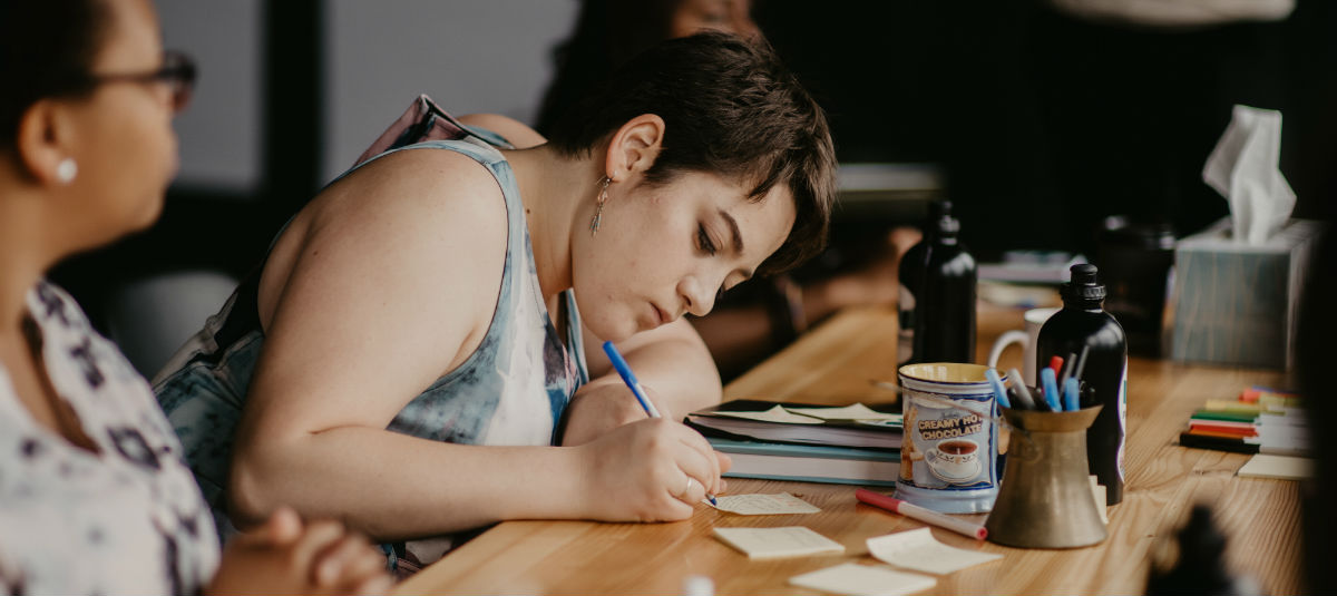 girl taking notes