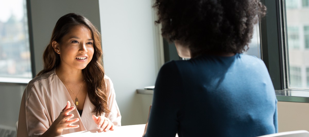 women talking in an interview