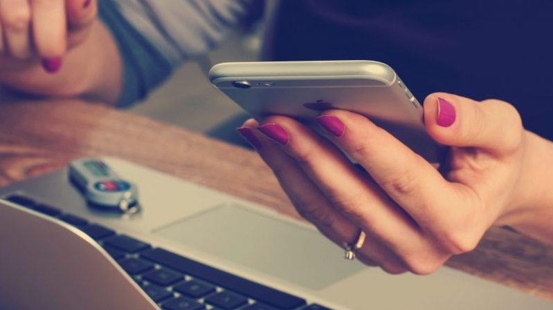 Woman holding iPhone