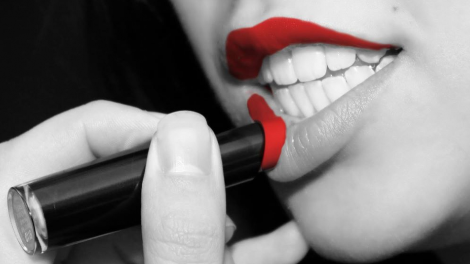 Woman Applies Lipstick