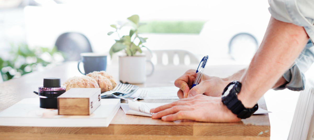 Man taking notes at a desk