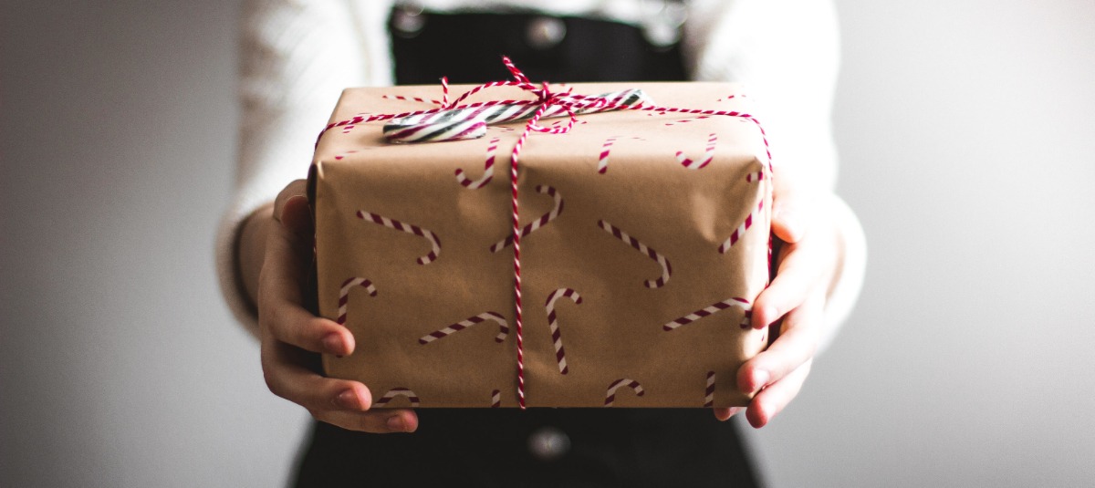 Woman holding out a gift