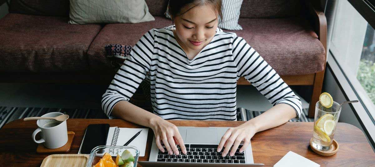 striped shirt girl typing