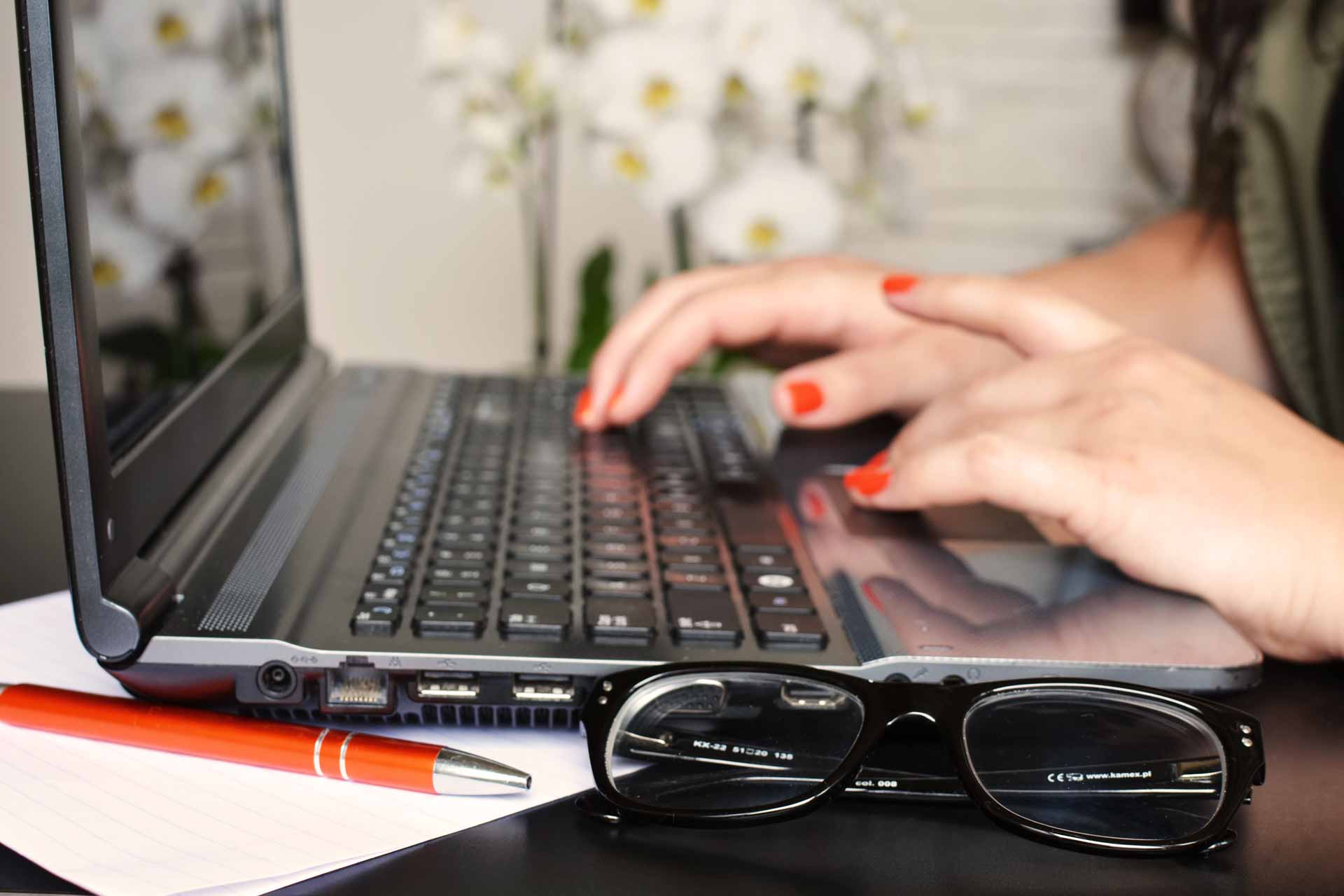 woman fiercely typing on computer