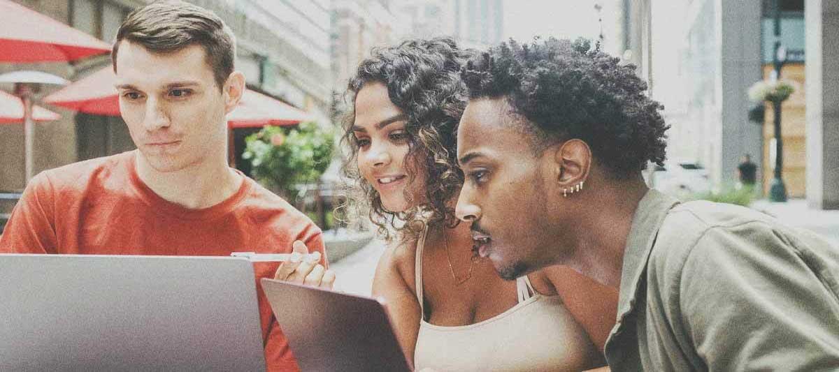 people looking at laptop