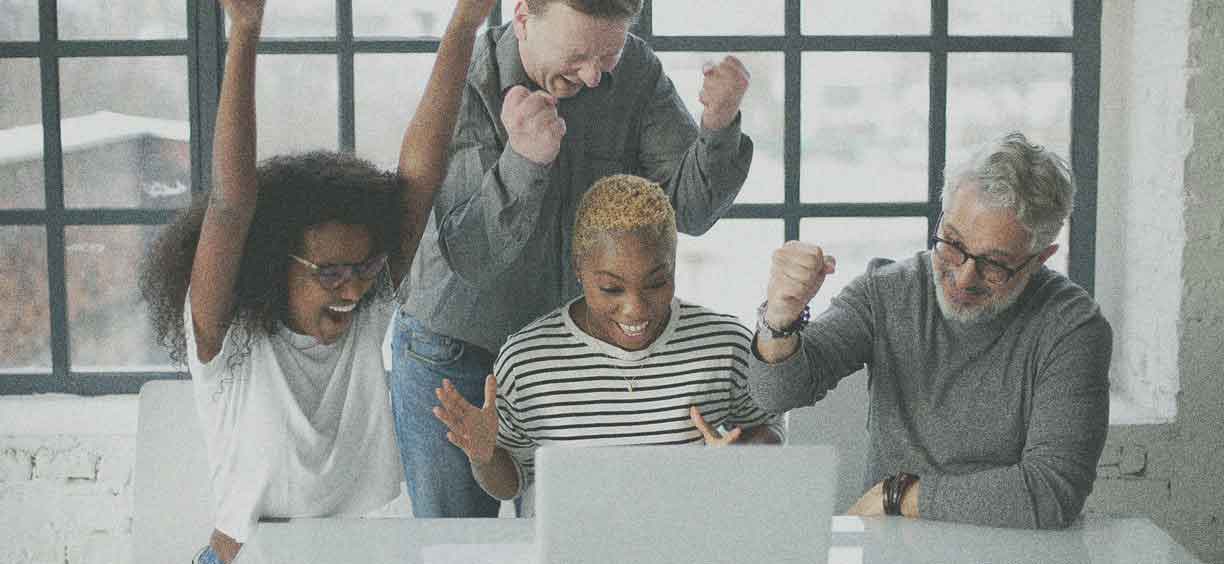 coworkers celebrating giving tuesday success