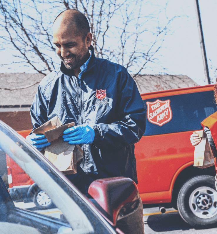 Salvation Army employee helping