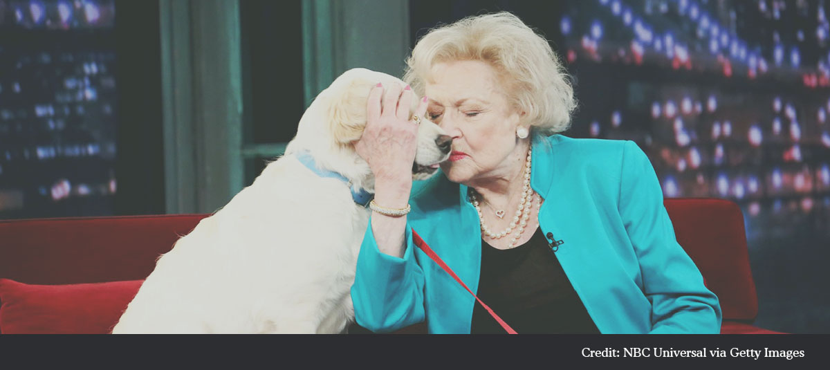 Betty White Holding Dog