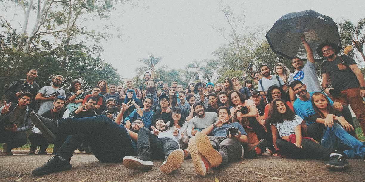 large huddle of people in a group photo outside