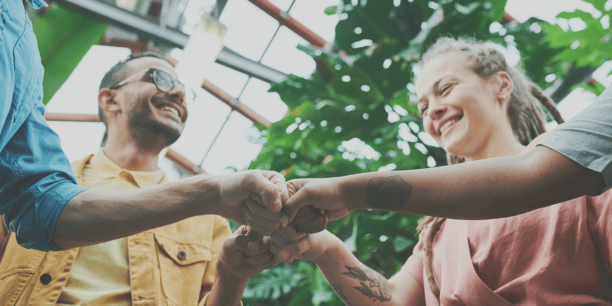 group fist bump in greenhouse