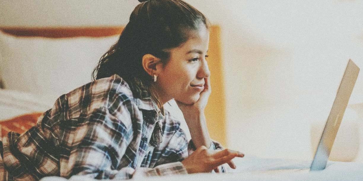 Girl in plaid using a laptop
