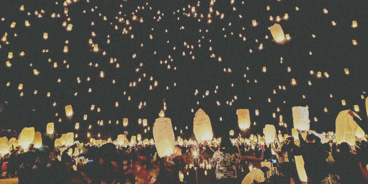 paper lanterns being released in the sky