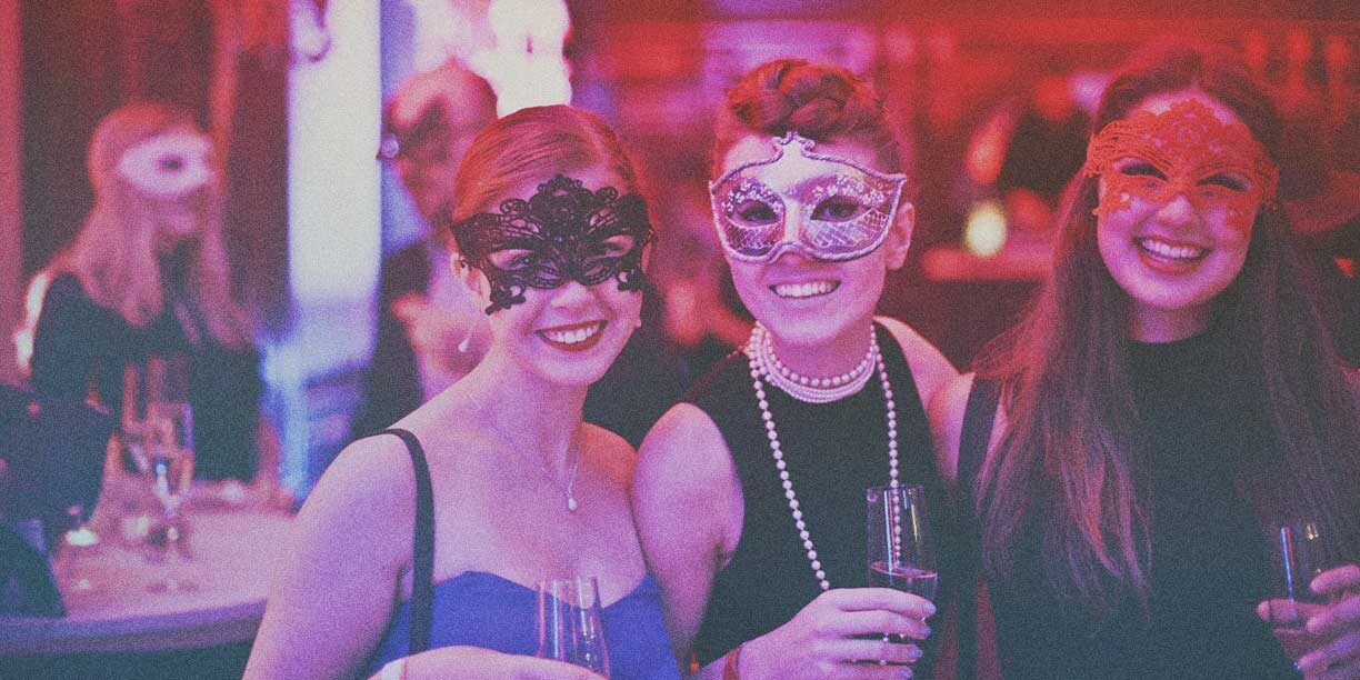 Girls in masks at a nonprofit gala